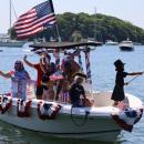 The Ruggiero family rides past Onset Pier. 