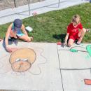 Cassidy Crompton, 10, drew a dog with a bowtie, while her brother, Chace, 8 drew a character from "Minions and Monsters." Photo by Christian Uva