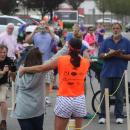 Racers cross the finish line during the 2017 Lazy Lobster road race. File photo