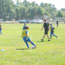 A player passes the ball in a warmup drill.