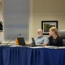 Student representative Emily Brundage, right, tells School Committee Chair Geoffrey Swett, left, and member Roger Bonin, center, about the updated digital hall pass system. Photo by Christian Uva