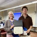 Superintendent Amy Hartley-Matteson presents Wareham High School senior Mark Deyoe with the Massachusetts Association of School Superintendents Certificate of Academic Excellence during the School Committee's Oct. 29 meeting. Photo by Erin Darling