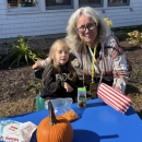 Eating a snack before pumpkin painting. 