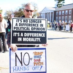 Many like David carried two signs.