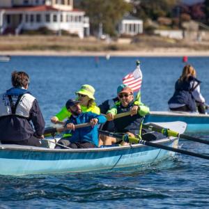 Doug Mclellen, John De Beaollo, Cassie Havey,  Bruce Gehrlein and Eric Ratchote row toward Wickets Island. none