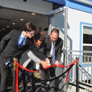 Church leadership cuts the ribbon before the first indoor service. Photos source: Grace Lighthouse Church