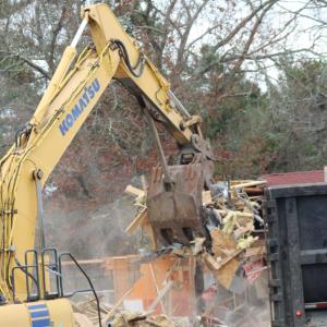 A large dumpster waited for scraps from the building.