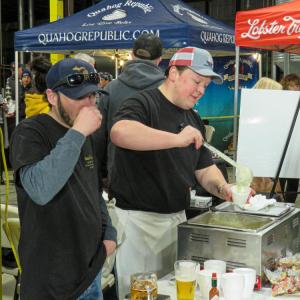 George Stuart, left, and Dan Degan serve of Luna Mezza’s signature chowder to attendees in 2025. File photo