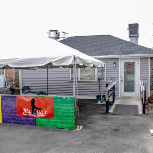 The restaurant is nestled behind Brennan's Smoke Shop.