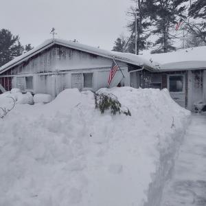 No, this home isn't painted white, that's snow coverage! Photo source: Larry Trahan