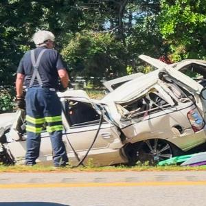 A crashed into a guardrail and rolled over into the median near mile marker 2.7 on Monday, July 13. Photo by David Curran