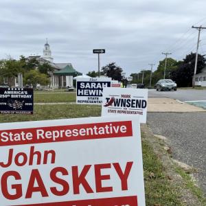 Signs for state representative candidates near Wareham Town Hall, one of the town's three polling locations. Photo by Christian Uva