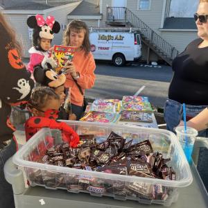 Kids pick out candy and coloring books. 