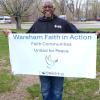 Wareham Faith and Action member beams with a banner. Photos source: Nancy Cushman Rice