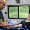 Phlebotomist Angel Martinez, left, begins drawing Arisa Whynot's blood during the Wareham Police Department's blood drive on Saturday, May 9. Photos by Grace Roche