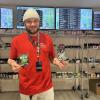 Jose Lemos poses with some of the shops new product. Photos by Brandy Muz