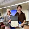 Superintendent Amy Hartley-Matteson presents Wareham High School senior Mark Deyoe with the Massachusetts Association of School Superintendents Certificate of Academic Excellence during the School Committee's Oct. 29 meeting. Photo by Erin Darling
